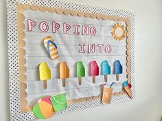 a bulletin board with popsicles on it and the words poppin'in to