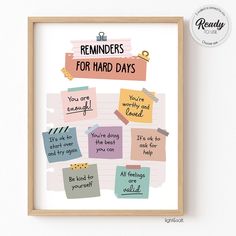 reminders for hard days are displayed in a wooden frame on the wall above it