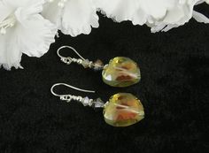 Handmade Sunset Crystal Heart Beaded Earrings, Heart Earrings, Handmade Earrings by SWCreations #BeadEarrings #BeadedEarrings #EarringsHandmade #GlassEarrings #CrystalEarrings #heart #HeartEarrings #HandcraftedEarrings #HandmadeEarrings #GlassBeadEarrings Nickel Free Czech Glass Wedding Jewelry, Handmade Heart-shaped Czech Glass Jewelry, Handmade Amber Heart Jewelry, Handmade Heart-shaped Amber Jewelry, Handmade Iridescent Crystal Earrings As Gift, Handmade Heart-shaped Crystal Earrings For Gifts, Silver Beaded Heart Earrings Gift, Iridescent Czech Glass Jewelry For Gift, Handmade Iridescent Jewelry For Valentine's Day