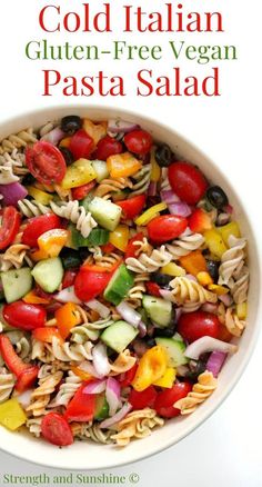 pasta salad in a white bowl with the title cold italian gluten - free vegan pasta salad