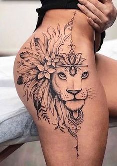 a woman's thigh with a lion tattoo on the side, and an image of a