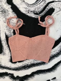 beautiful pink women's crochet corset crop top. Featuring a lace up back and self tie straps, this is the perfect top for summer. It can also be layered over a T-shirt or long sleeve!           ⭐️ lace up back         ⭐️4self tie straps         ⭐️ unlined          ⭐️ not intended to be worn in water  Measurements:   ⭐️Width: 24in   ⭐️Length: 6in   ⭐️Cup width: 7in   ⭐️Straps length: 25.5 in   ⭐️Back tie length: 70 in  💫This item is ready to ship!💫 Crochet Corset Top Pattern Free, Crochet Bustier Top, Etsy Outfits, Babydoll Top Outfit, Crochet Corset Top, Crochet Bustier, Peplum Top Outfits, Crochet Corset, Stylish Tops For Girls