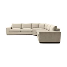 a large sectional couch sitting on top of a white floor