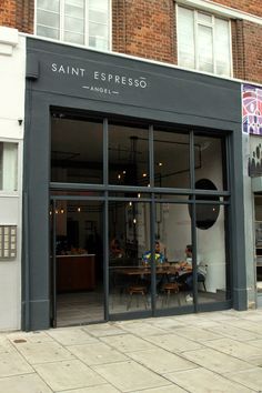 the store front of saint espresso in an urban setting