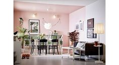 a living room filled with lots of furniture next to a dining room table and chairs