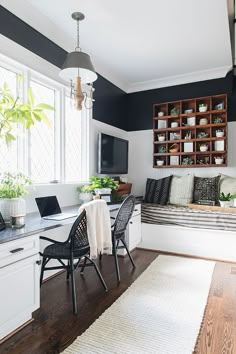 a living room filled with furniture next to a window