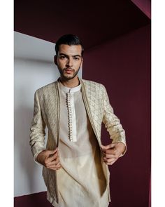 Moondust Jacket Set - Contrast by Parth An embroidered shawl-collar jacket perfectly complements a textured Chanderi kurta and pants ensemble Included in purchase: Jacket, Kurta and Pants Product Specification Color: Cream (can be customized) Fabric: Pure Silk Occasion: Formal Event, Wedding, Bridal, Reception Style: Jacket Set Designer: Contrast by Parth Care: Dry Clean Only Work: Hand Embroidered ( Variation in color, fabric & detail is possible. Model images are only representative.) This can be customized in any color, size or style of your choice. ** Please contact us at 19257910374 for customization options. Delivery time for customized outfits is 4 - 6 weeks. Men Waistcoat Outfits, Striped Kurta, Elegant Portrait, Kurta And Pants, Bride Indian, Wedding Trousseau, Collar Embroidery, Embroidery Jacket, Chanderi Kurta