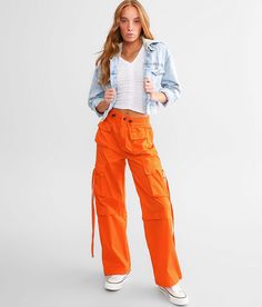 Vibrant M.I.U. Wide Leg Cargo Pant - Orange Medium, Women's Orange Solid stretch pant Inseam measures 30 1/2 Rise measures 11 Elasticized cinch tie waistband Back snap flap pockets Cinch tie bottom openings. 65% Cotton 32% Polyester 3% Spandex. Hand wash cold water inside out. Do not bleach. Do not tumble dry. Do not iron.. WOMEN'S BOTTOMS SIZE CONVERSION CHART Waist (size) 22 23 24 25 26 27 28 29 30 31 32 33 34 36 38 Juniors - 00 0 1 3 5 7 9 11 13 15 - - - - US - - 00 0 2 4 6 8 10 12 14 16 18 2 Orange Cargo Pants Outfit, Cargo Outfits Women, Cargo Pants Outfit Women, Cargo Outfit, Orange Pants, Pant For Women, Cargo Pants Outfit, Orange Outfit, Flannel Women