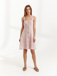 "INDIE is a simple strappy linen mini button down dress. DETAILS - Above knee length - Spaghetti straps - Coconut buttons - Oeko-Tex certified 100% lightweight linen - Cut and sewn to order just for you in our studio COLOR - Apple Blossom, you can also choose other colors above - Fabric samples are available here https://www.etsy.com/listing/586569696/linen-fabric-samples SIZING & FIT - Fits true to size - Model is 5'8.9\" / 175cm and wearing a size XS CARE FOR LINEN - Machine wash up to 30º Summer Mini Dress With Buttons And Square Neck, Spring Midi Dress With Buttons And Spaghetti Straps, Summer Linen Mini Dress With Buttons, Spring Linen Mini Dress With Adjustable Straps, Mini Linen Dress With Adjustable Straps, Fitted Linen Knee-length Sundress, Fitted Knee-length Linen Sundress, Knee-length Mini Dress With Buttons For Summer, Linen Mini Dress With Buttons