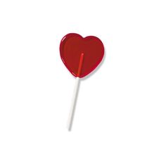 a heart shaped lollipop on a white background with a red stick sticking out of it