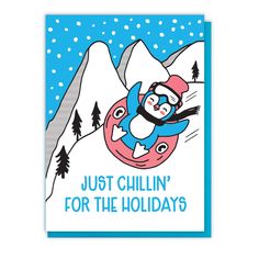 a card that says, just chillin'for the holidays with an image of a penguin sledding down a hill