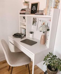 a white desk with a laptop on it