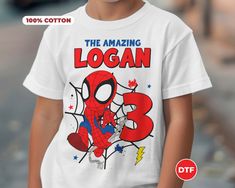 a young boy wearing a spiderman t - shirt with the title, the amazing logan 3