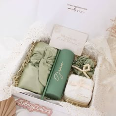 an open gift box containing personal items for the bride and groom to use on their wedding day