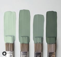 three paint brushes with different shades of blue