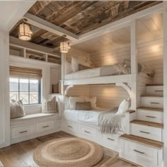 a bedroom with bunk beds and drawers in it