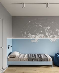 a bedroom with blue walls and white bedding, an aquarium mural on the wall