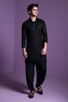 Black kurta featuring delicate chikankari embroidery highlighted with sequin embellishments. Comes with a plain salwar.
Components: 2
Pattern: Embroidered
Type Of Work: Chikankari
Neckline: Mandarin Collar
Sleeve Type: Full
Fabric: Georgette
Color: Black
Other Details: 
Straight silhouette
Sequin detailing
Occasion: Sangeet - Aza Fashions Salwar For Men, Black Kurta Set, Black Kurta, Chikankari Embroidery, Kurta For Men, Wedding Outfit Men, Dhoti Pants, Indian Wedding Wear, Wear Store