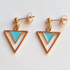 Inverted triangle-shaped earrings forming two triangles, one of them enameled in sky blue and hypoallergenic gold-plated stainless steel clasps ✨. Measurements: 2.1 cm high x 1.7 cm wide. Blue Triangle Earrings For Gift, Inverted Triangle, Earrings Blue, Elegant Earrings, Triangles, Sky Blue, Jewelry Earrings Dangle, Dangle Drop Earrings, Dangle Earrings