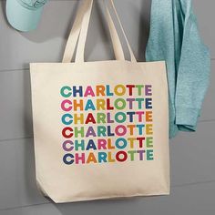 Personalized with any name in your choice of color Holds various items while travelingIncludes one tote bagCotton canvas bag with natural web strapsMachine washMeasures 20" W x 15" H x 5" DWeighs .5 lb.Imported Whether a trip to the library, preschool or grandma's house they need a special spot for all their belongings! The Vibrant Name Personalized Canvas Tote Bags are just the place to stash their special things. Multicolor Personalized Bags For Everyday Use, Personalized Multicolor Bags For Everyday, Everyday Personalized Multicolor Bags, Personalized Multicolor Bags For Everyday Use, Personalized Cotton Canvas Bag For School, Personalized Cotton Canvas School Bag, Personalized White Canvas Bag For School, Eco-friendly Multicolor Canvas School Bag, Multicolor Cotton Bag With Letter Print