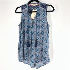 Rewind Boho Style Floral Flowy Top In Size Medium Boho Style Sleeveless Floral Pattern Flowy And Soft Material 100% Polyester Patterned Sleeveless Bohemian Blouse, Bohemian Sleeveless Patterned Blouse, Blue Bohemian Sleeveless Blouse, Blue Sleeveless Bohemian Blouse, Sleeveless Blue Blouse For The Beach, Off Shoulder Floral Top, Burgundy Blouse, High Low Blouse, Boho Lace