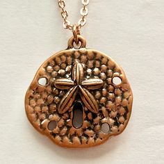 Copper Sand Dollar Pendant Necklace Great Addition To Your Sea Life Collection Message Sea Life Pendant Strength 18 Inch Rolo Style Chain Rose Gold & Copper Plated Metal Alloy New Condition. Watermelon Heart, St Christopher Necklace, Sand Dollar Pendant, Copper Rose Gold, Beach Lover Gifts, Braided Necklace, Copper Rose, Layered Necklace Set, Purple Necklace