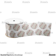 a roll of baseball wrapping paper on top of a white background with red stitching