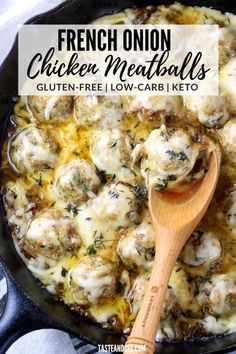 a skillet filled with chicken meatballs covered in melted cheese and topped with a wooden spoon