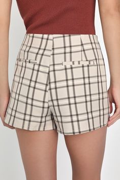 You're sure to win best style when you've got an adorable look like the Lulus Superlative Sweetie Beige and Brown Plaid Skort! Lightweight woven fabric, with a classic plaid pattern throughout, shapes this darling skort that has a high waist and a skirt-style overlay at the front with flirty, double-notched hems and decorative welt pockets at back. Attached shorts complete the look. Hidden zipper/clasp at side. Fit: This garment fits true to size. Length: Mid-thigh. Size medium measures 13.75" from waist to hem. Inseam: 2.50 Front Rise: 12.75 Waist: Fitted - very fitted at natural waist. Hip: Loosely Fitted. Fabric: Fabric has no stretch. Unlined. 97% Polyester, 3% Spandex. Hand Wash Cold. Do Not Bleach. Line Dry. Iron Low Heat. Imported. Lulus | Superlative Sweetie Beige and Brown Plaid S Trendy Plaid Bottoms For Day Out, Trendy Plaid Shorts For Day Out, Chic Plaid Short Bottoms, Chic Plaid Short-length Bottoms, Plaid Short Bottoms For Fall, Chic Plaid Cotton Shorts, Trendy Fitted Plaid Shorts, Chic Short Plaid Bottoms, Chic Fitted Plaid Shorts