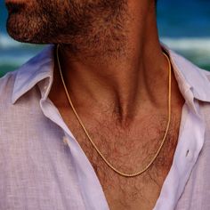 Men's Layering Stacking 18K Gold Plated Stainless Steel Chain Necklace Jewelry Gift for Men ----------------------------- Looking for a gift for your man? You've found the perfect item for this!  A classic and delicate stainless steel necklace, but at the same time, raises your style to another level. Both inside the shirt and outside, it upgrades the look and adds a tone of masculinity! Will fit perfectly with any style of clothing, t-shirt or button-up. The chain is 100% waterproof - you won't have to take it down to the gym/swimming pool and of course the shower. Can match perfectly with other necklaces. The thickness of the chain is 2 mm. Item will arrive in a pretty gift wrap, ready to give, with my brand logo. See more gorgeous gold necklaces for gents here -> https://etsy.me/3s37TYb Men Gold Chain, Mens Layering, Shirt With Chains, Gents Shirts, Gold Necklace For Men, Chain Necklace For Men, Gift Husband, Stainless Steel Chain Necklace, Mens Gold Bracelets