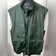 No Boundaries Nwot Men’s Sleeveless Zipper Vest Jacket, Size L, Olive Color, Multiple Front Pockets That Zip And Velcro, Adjustable Velcro Bottom Back On Both Sides, 100% Polyester Lining And Polyurethane Backing Green Sleeveless Utility Outerwear, Sleeveless Green Outerwear For Streetwear, Green Sleeveless Outerwear For Streetwear, Military Style Green Sleeveless Vest, Green Military Sleeveless Vest, Military Sleeveless Vest For Hiking, Sleeveless Military Vest For Hiking, Military Style Vest For Hiking, Zipper Vest