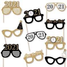 new year's eve photo booth props with sunglasses and glasses on sticks for the party