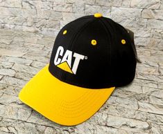 Adjustable Black Hat With Cat Design, Casual Cap With Cat Design, Casual Cat Design Cap, Cat Equipment, Yellow And Blue, Snap Backs, Caterpillar, Logo Embroidered, Black N Yellow