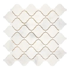 a white and gold tile pattern