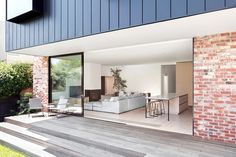 an open living room and dining area with sliding glass doors