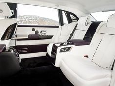 the interior of a white car with black trim