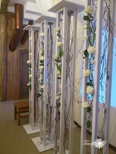 white flowers and vines are on display in a church