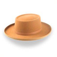 Description Materials Craftsmanship Hat Care Shipping Returns Product Description A Gambler Style Cowboy Hat for All Occasions Discover the perfect blend of style and comfort with the Ithaca, a gambler-style cowboy hat crafted from premium rabbit fur felt. This hat features a distinctive telescope crown and a 3 1/2" ribbon-bound rolled brim, ensuring a standout look that captures rugged elegance. The leather hat belt adds a touch of refinement, while the viscose satin lining and genuine leather Cowboy Hat Crafts, Homburg, Chapeau Cowboy, Leather Hat, Cowboy Style, Leather Hats, Formal Casual, Cow Boy, Custom Monogram