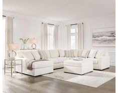 a large white sectional couch in a living room