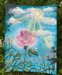 a painting of a pink rose with the sun in the sky above it on some grass