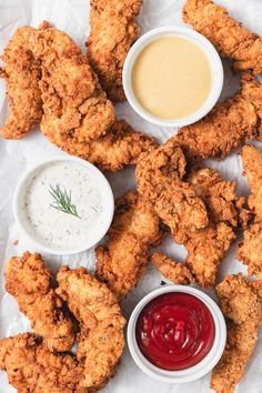 fried chicken with dipping sauces on the side