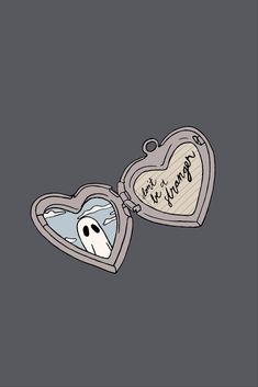 an open heart shaped box with a ghost in it's mouth and writing on the inside