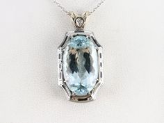 We've crafted this aquamarine pendant from stunning Art Deco components! The mounting is etched with beautiful structured details, crisp black enamel, and a single sparkling diamond. The centerpiece is a stunning sparkling aquamarine in a classic oval cut. This aquamarine is a clear, icy blue, standing out magnificently amongst the polished white gold. This pendant does not come with the chain shown. Please feel free to contact us, we will help you find the perfect chain for your style and budge Aquamarine Pendant, Cameo Ring, Sparkling Diamond, March Birthstone, Icy Blue, Statement Pendant, March Birth Stone, Sparkle Diamonds, Vintage Jewellery