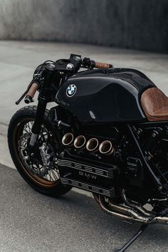 a black and brown motorcycle parked on the street