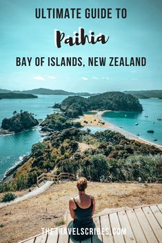 a woman sitting on a bench looking out at the water and land with text overlay that reads ultimate guide to paiha bay of islands, new zealand