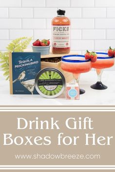 the drink gift box for her is filled with fruit and drinks, including two cocktail glasses