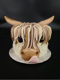 a cake decorated to look like a cow's head