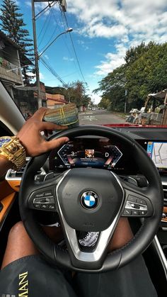 a man driving a car down a street