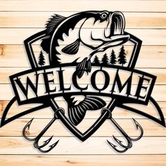 a welcome sign with fishing hooks and trees on the side of a wooden wall that says welcome