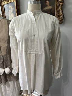 Our Edwardian Hand made Linen Poet Shirt is made soft and relaxed in natural white linen. It has Hand stitched button holes, linen thread Dorset buttons and open button holes for cuff links. The shirt measures flat 22" at the under arm, Sleeve length from center back neck 32"s, and collar band 15"s. Please convo with any questions. Hand wash recommended. Classic Linen Blouse With Buttons, White Shirt With Covered Buttons For Daywear, White Linen Blouse With Placket, Cream Linen Tops With Buttons, Cream Linen Top With Buttons, Cream Linen Tops For Daywear, White Linen Blouse With Button Cuffs, Classic Beige Linen Blouse, Classic Cream Linen Shirt